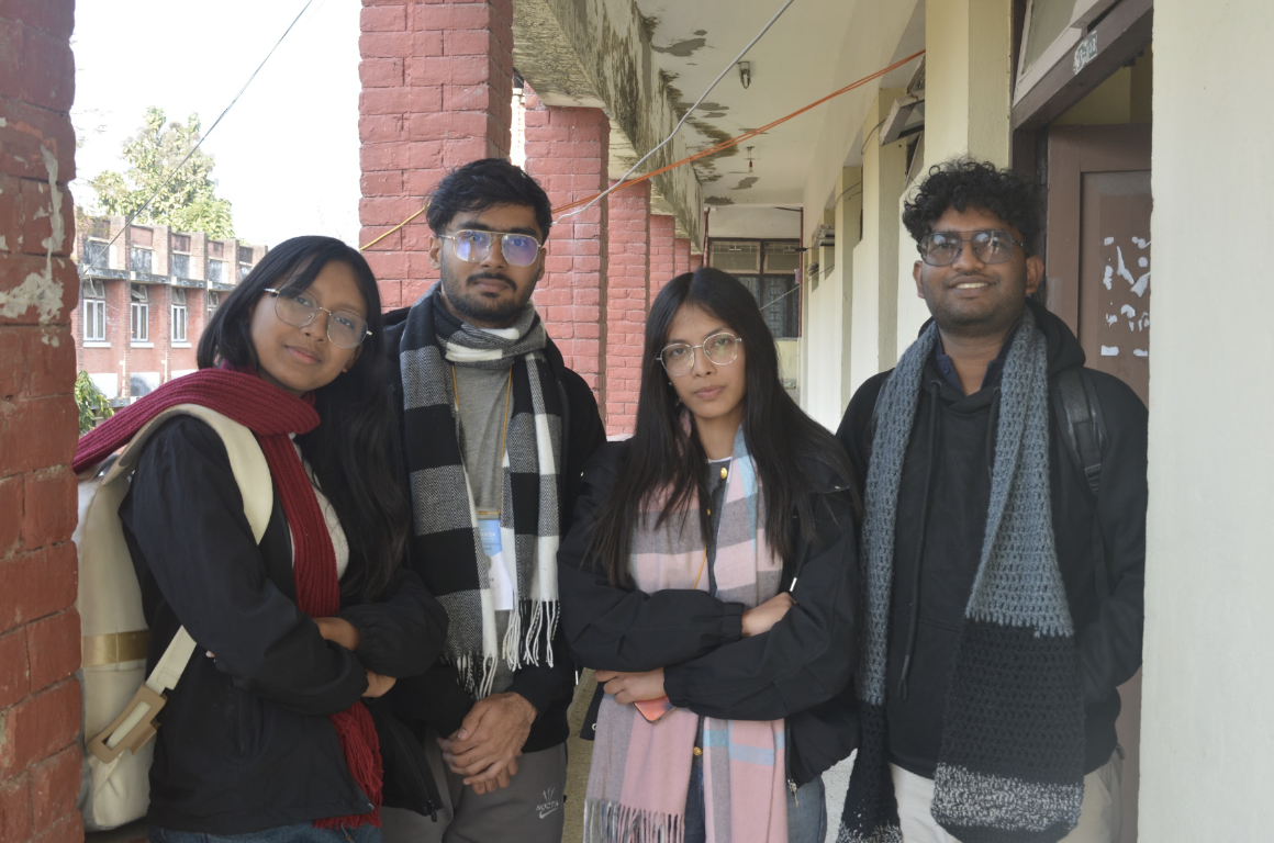 Artemis project team standing together in a university corridor