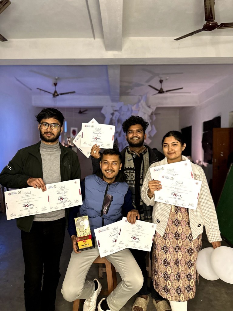 Sanjaya teammates celebrating their X-Hack 3.0 win with certificates and prize cheque