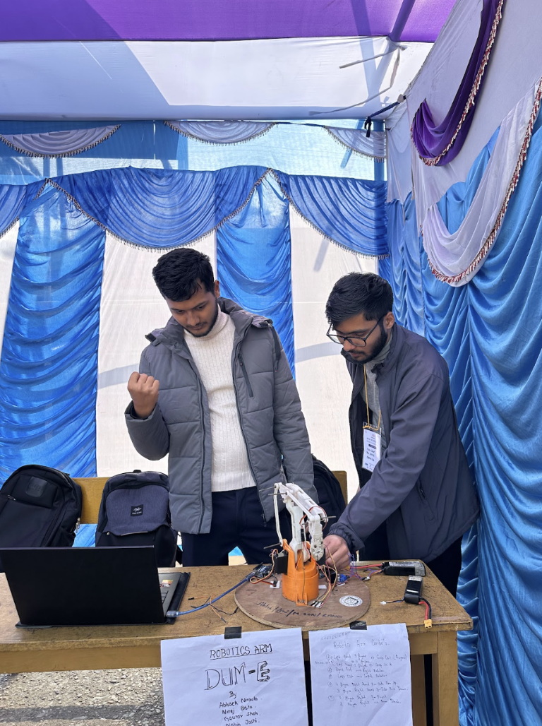 A robotic arm computer vision project being demonstrated at an exhibition